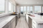 Fully equipped kitchen with 180 degree views of Fisher Beach 